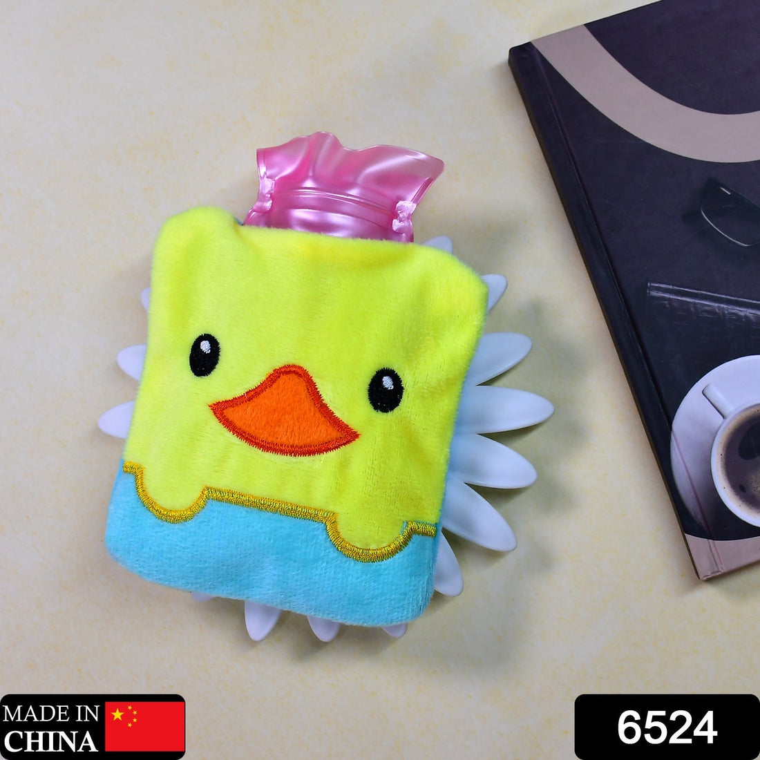 Mini hot water bag with yellow duck cover for soothing neck pain.